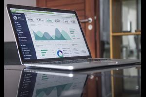 Laptop on table and with data on the screen