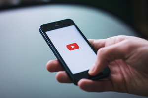 Cellphone with youtube logo on screen